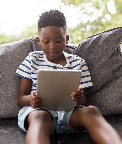 Boy reading tablet